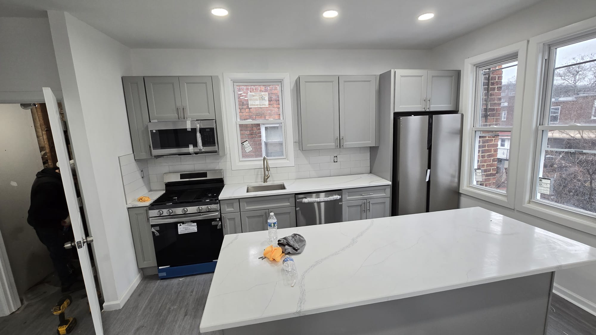 Completed Kitchen — Gray Cabinets & Quartz Island